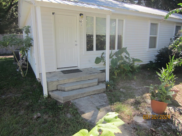 doorway to property with central air condition unit