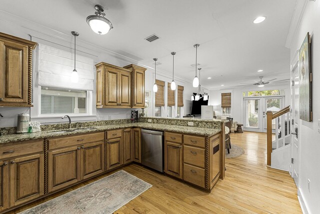 kitchen featuring dishwasher, crown molding, and brown cabinets