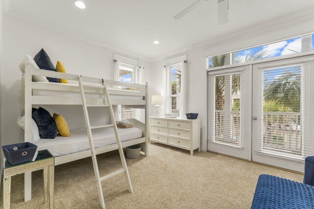 carpeted bedroom with ceiling fan, ornamental molding, access to exterior, french doors, and recessed lighting