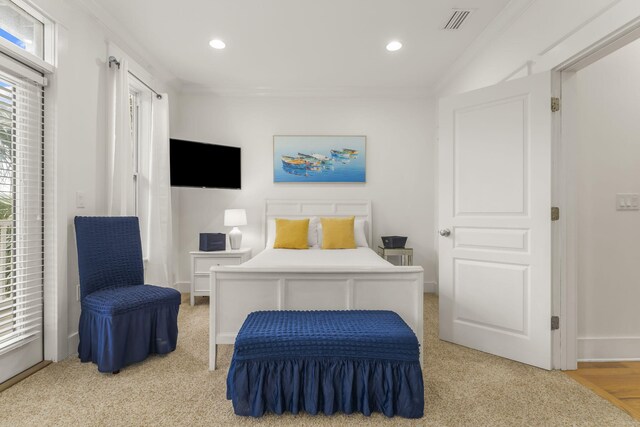 bedroom featuring baseboards, visible vents, crown molding, and recessed lighting