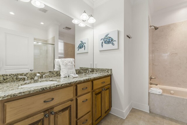 bathroom featuring a bathtub, a shower with door, double vanity, a sink, and tile patterned flooring