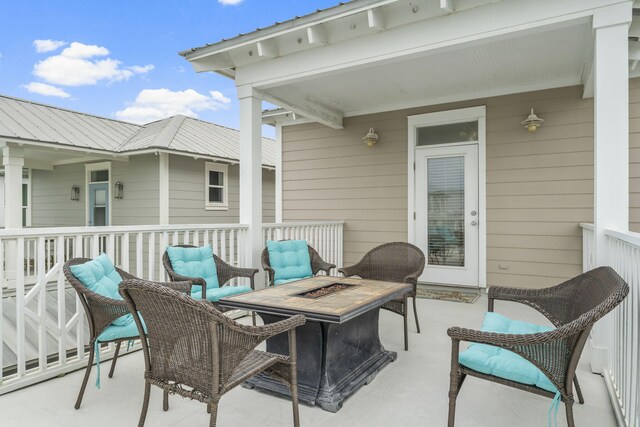 view of patio / terrace featuring an outdoor fire pit