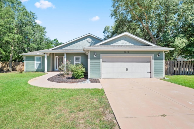 single story home with a garage and a front yard