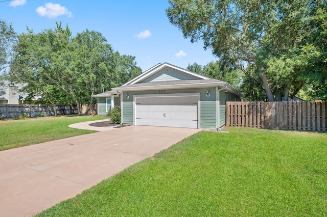 single story home featuring a garage and a front lawn