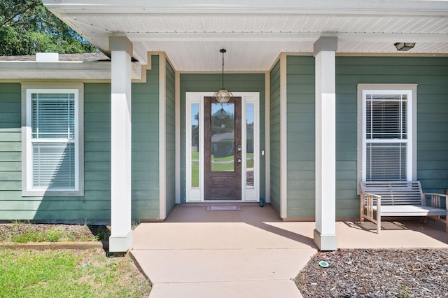 entrance to property featuring a porch