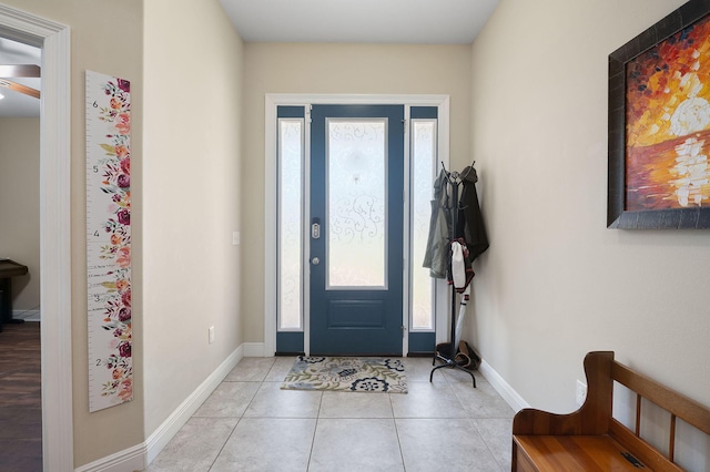 entryway with light tile patterned flooring