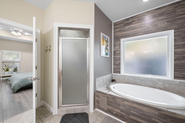 bathroom with separate shower and tub, lofted ceiling, and hardwood / wood-style flooring