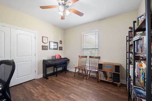 home office featuring ceiling fan and dark wood-type flooring