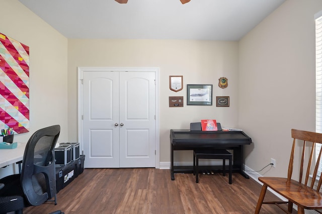 office featuring dark hardwood / wood-style floors and ceiling fan