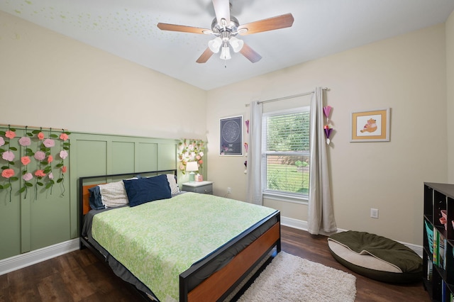 bedroom featuring ceiling fan and dark hardwood / wood-style flooring