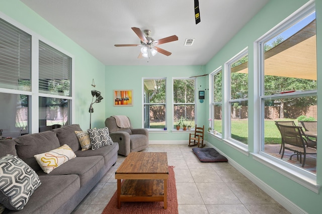 sunroom / solarium with ceiling fan and a healthy amount of sunlight