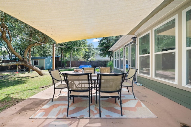 view of patio / terrace with a storage shed