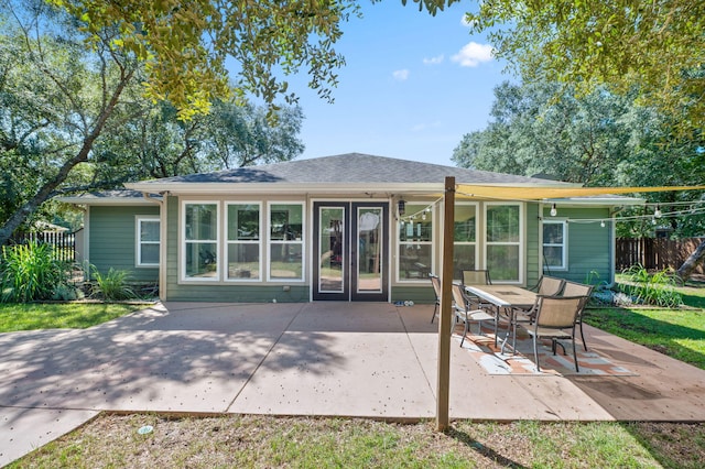 rear view of property with a patio and french doors