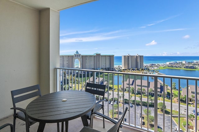 balcony with a water view and a city view