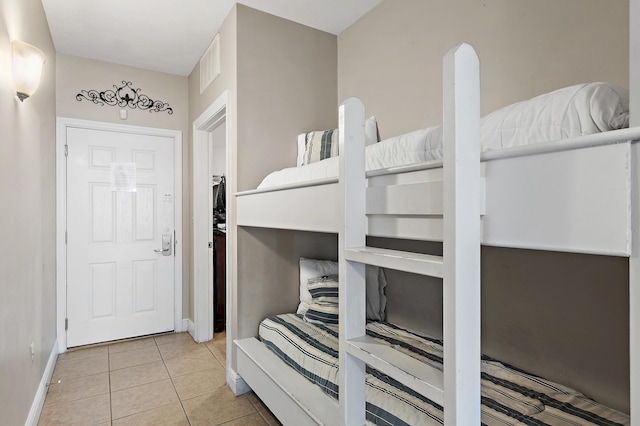 bedroom featuring light tile patterned flooring