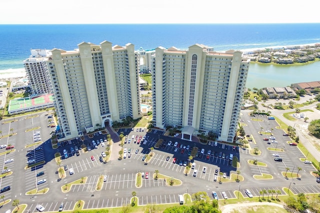 bird's eye view featuring a view of the beach and a water view