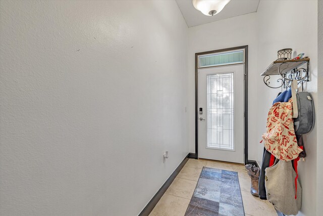 entryway featuring light tile patterned floors