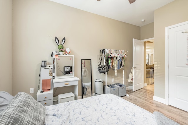 bedroom featuring ceiling fan and light hardwood / wood-style flooring