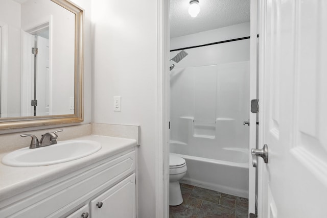 full bathroom featuring vanity, shower / bath combination, toilet, and a textured ceiling