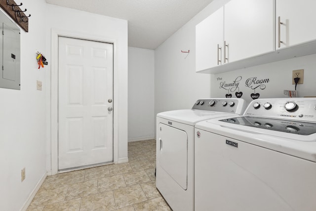 washroom featuring cabinets, a textured ceiling, electric panel, washer and dryer, and light tile patterned floors