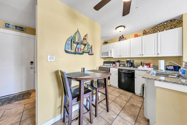 kitchen featuring dishwasher, white cabinets, and sink