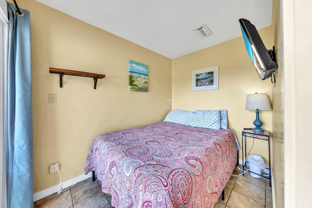 bedroom featuring light tile patterned floors