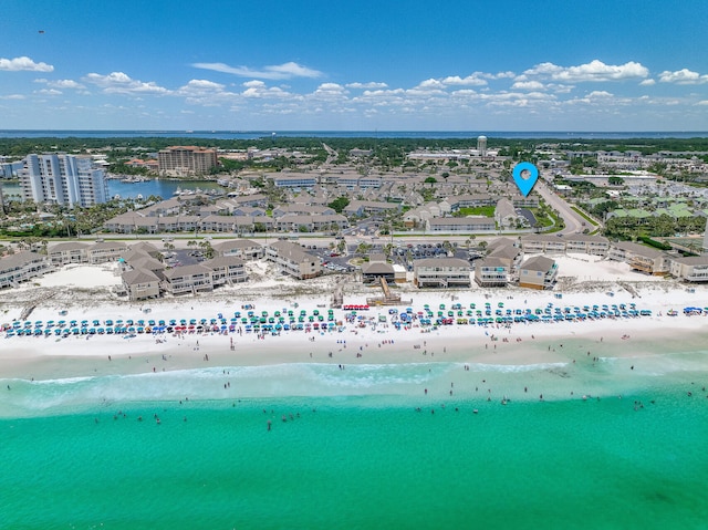 birds eye view of property featuring a water view and a view of the beach