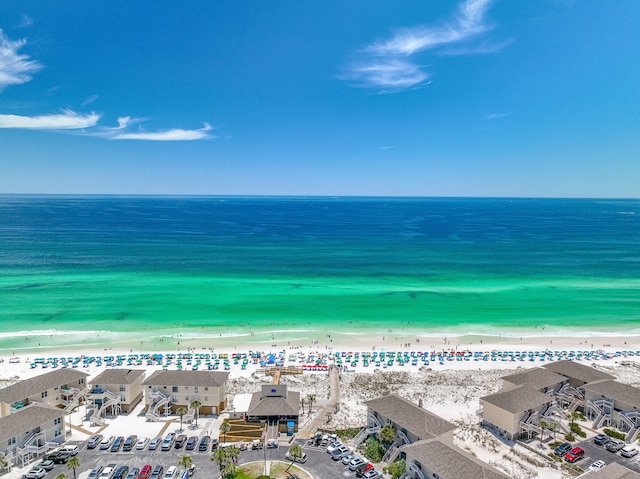 aerial view with a water view and a view of the beach