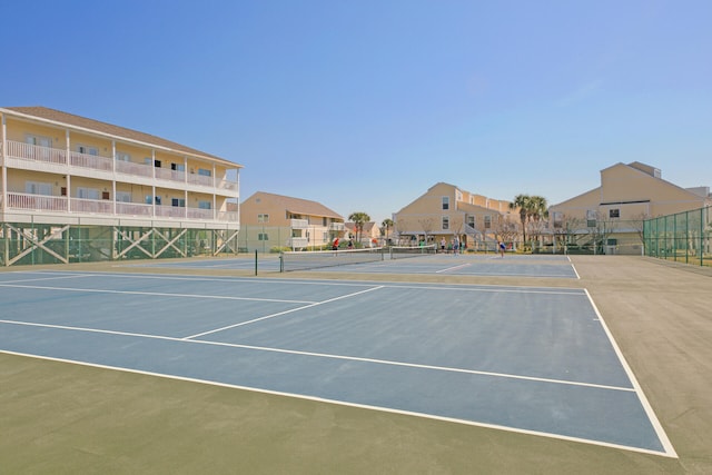 view of tennis court featuring basketball court