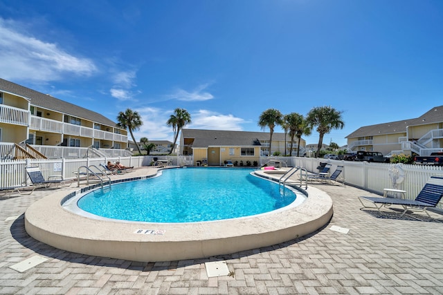 view of swimming pool with a patio area