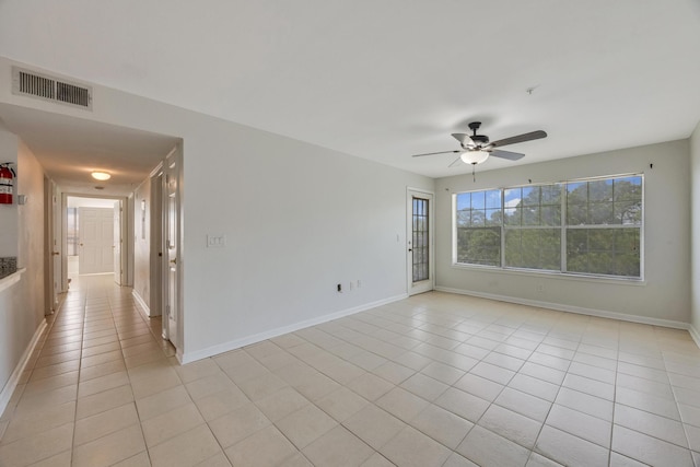 unfurnished room featuring ceiling fan and light tile patterned floors