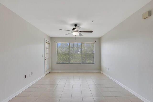 unfurnished room featuring ceiling fan and light tile patterned flooring