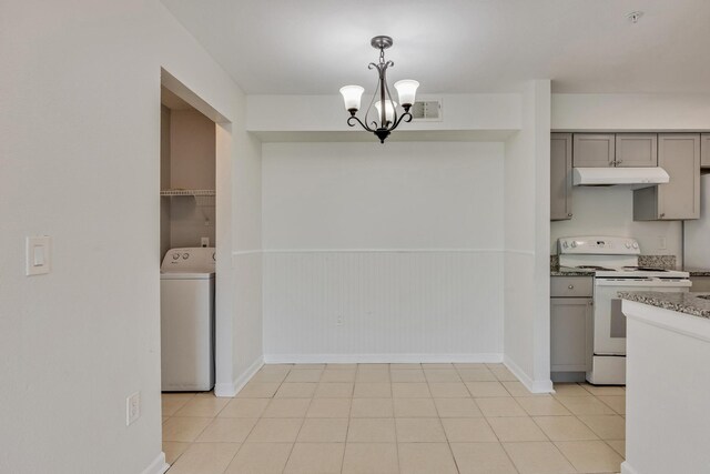 kitchen with gray cabinets, washer / dryer, electric range, an inviting chandelier, and decorative light fixtures