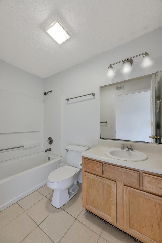 full bathroom featuring vanity, a textured ceiling, shower / bathtub combination, toilet, and tile patterned floors