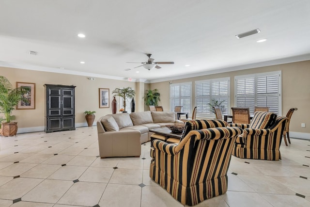 tiled living room with ceiling fan and crown molding