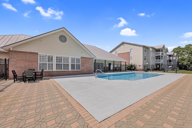 view of pool featuring a patio