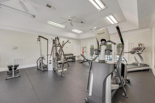 gym featuring ceiling fan and crown molding