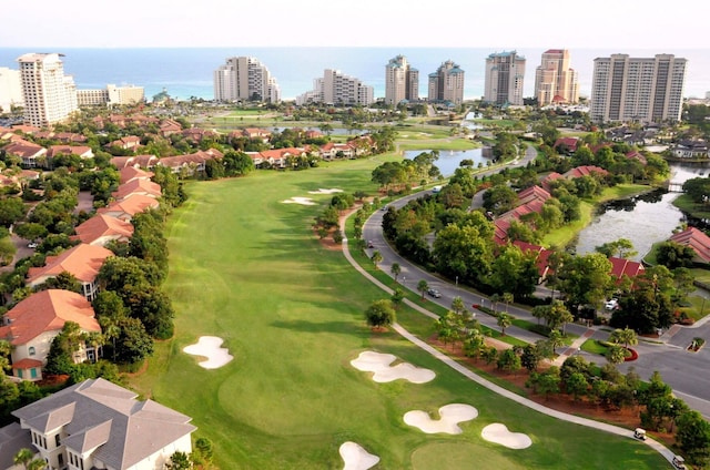 bird's eye view with view of golf course and a water view