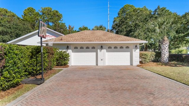 exterior space featuring decorative driveway