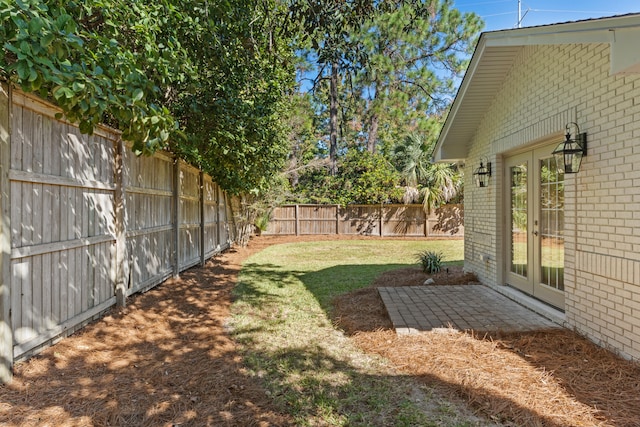 view of yard with french doors