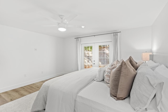 bedroom featuring ceiling fan, baseboards, french doors, and light wood finished floors