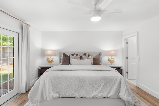 bedroom featuring ceiling fan, access to outside, and light hardwood / wood-style flooring