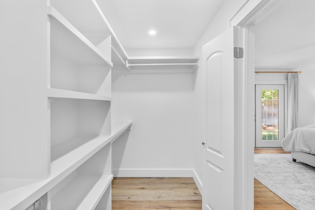 walk in closet featuring light wood-type flooring