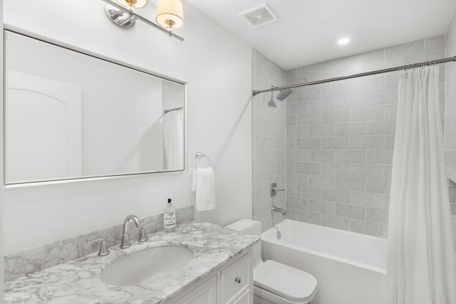 full bathroom with shower / bath combination with curtain, toilet, and vanity