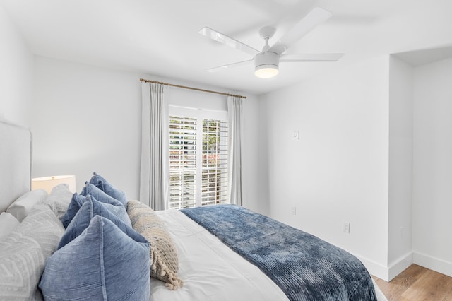 bedroom featuring hardwood / wood-style floors and ceiling fan