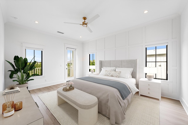 394 Grande Pointe Cir, Inlet Beach, FL 32461 - bedroom featuring multiple windows, access to outside, light wood finished floors, a decorative wall, and a ceiling fan