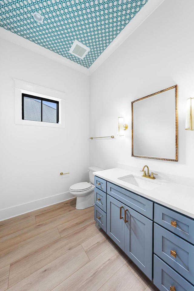 394 Grande Pointe Cir, Inlet Beach, FL 32461 - bathroom with vanity, toilet, wood finished floors, and baseboards