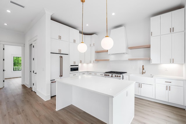 394 Grande Pointe Cir, Inlet Beach, FL 32461 - kitchen with open shelves, white appliances, a sink, recessed lighting, and light wood-type flooring