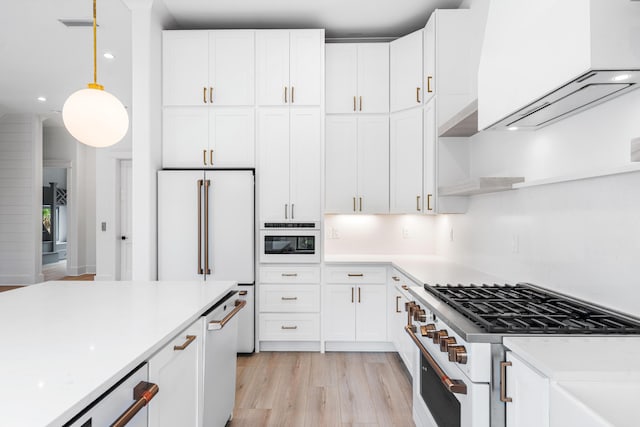 394 Grande Pointe Cir, Inlet Beach, FL 32461 - kitchen featuring high end appliances, light wood-style floors, light countertops, white cabinetry, and recessed lighting
