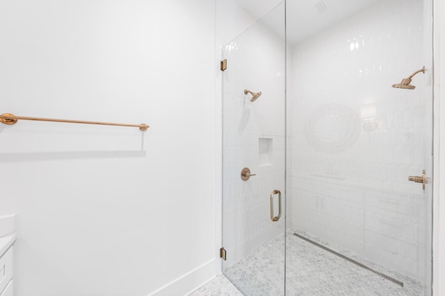 394 Grande Pointe Cir, Inlet Beach, FL 32461 - bathroom featuring a stall shower, vanity, and baseboards